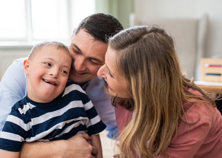 family with special needs child smiling